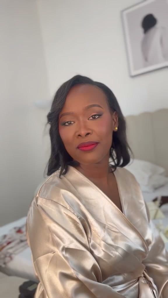 A second HYLA client in a gold robe with a red lip